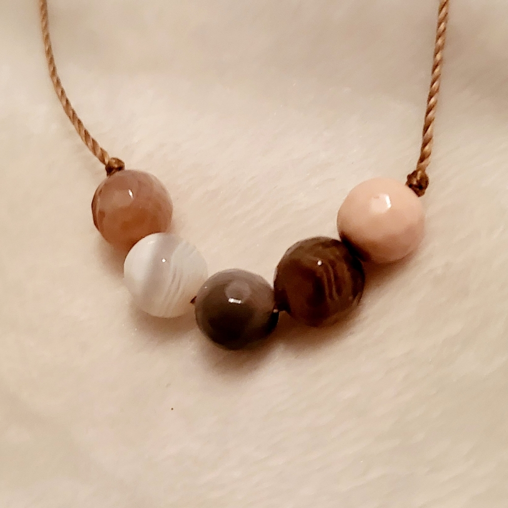 "Enlightening gemstone prosperity adornment."